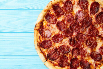 Pizza pepperoni fast food . Top view on rustic background