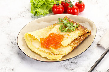 Russian pancake with red caviar