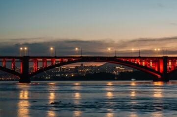 communal bridge over the Yenisei River in Krasnoyarsk at night