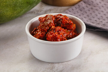 Spicy pickled raw green mango