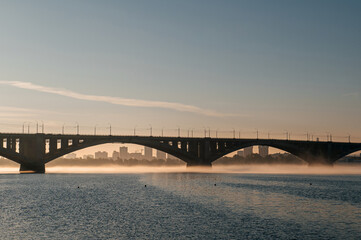 Naklejka premium communal bridge over the Yenisei River in Krasnoyarsk at dawn