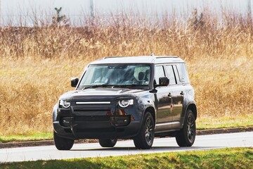 Sleek car driving through scenic countryside