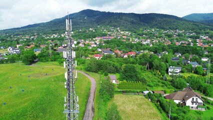 LTE Advanced Cell tower in countryside with winding road and mountains