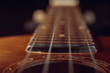 Ukulele body and strings close up.