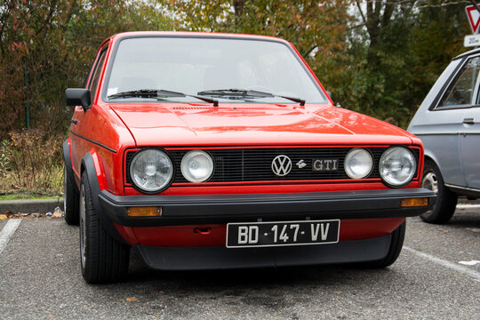 Mulhouse - France - 10 November 2024 - front view of red volkswagen golf GTI MK1 parked in the street