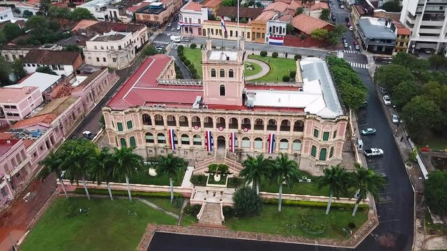 Camera moving over the city of asuncion in paraguay showing the government palace and other buildings