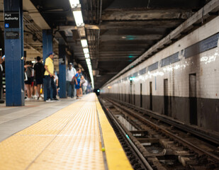 Waiting for the subway train at port authority station in new york city