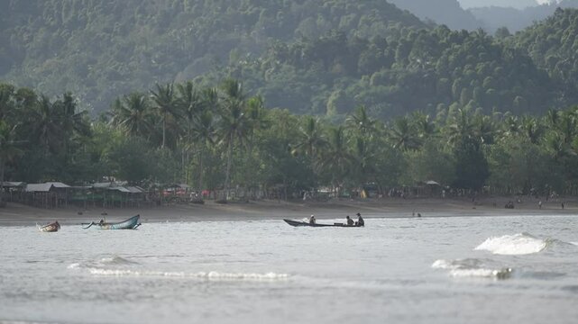 Distant view of a fisherman returning to the coast