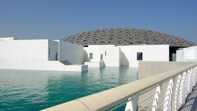 Abu Dhabi, United Arab Emirates - January 6, 2024: Louvre Abu Dhabi, showcasing its stunning modern architecture and iconic dome. museum s unique design and serene waterfront,