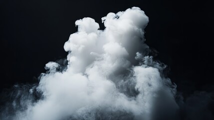 Puffy white cloud isolated on a solid black backdrop, illuminated to show off its fluffy shape