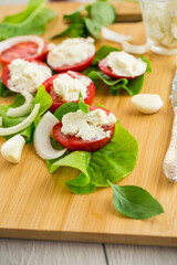 tomato wedges with cottage cheese filling and garlic, spicy appetizer