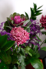 Stylish bouquet of lilac cabbage, purple chrysanthemums, Purple flower. Purple flowers background...