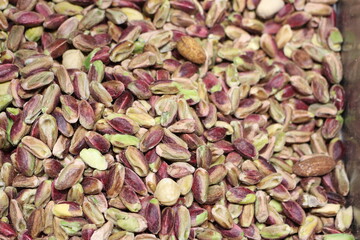Enjoy the Vibrant and Flavorful Pistachio Nuts Displayed in a Beautiful Rustic Setting