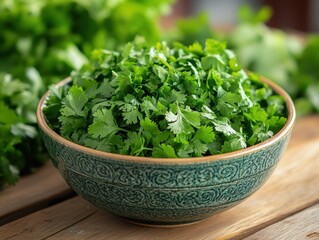 Fototapeta premium Fresh cilantro leaves in a decorative bowl, perfect for culinary uses and garnishing dishes with vibrant flavor and color.