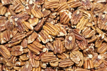 Captivating CloseUp of Scrumptious and Delicious Pecans Within a Rich Tapestry Background