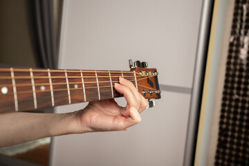 Hand Playing Acoustic Guitar Close-Up, musician strumming strings, guitarist practicing chords