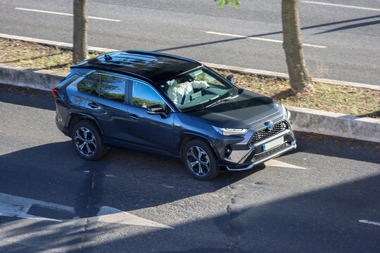 Businessman driving toyota rav4 hybrid car on the road