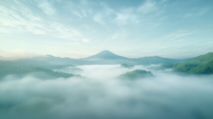 Naklejka premium A mountain range covered in fog