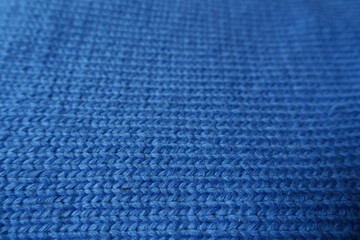 Macro of simple plain blue knitted fabric