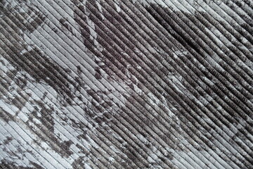 Top view of gray corduroy fabric with abstract print
