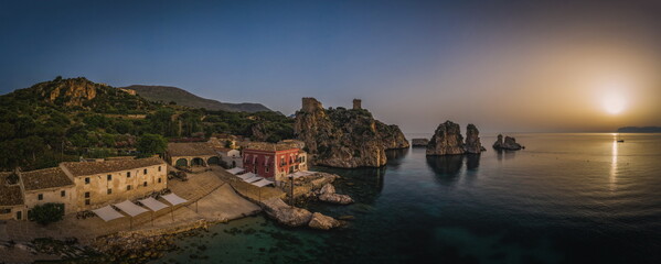 Wonderful Sights of The Stacks and Tonnara of Scopello Faraglioni e Vecchia Tonnara di Scopello , in Trapani Province, Sicily, Italy. June 2023, sunrise