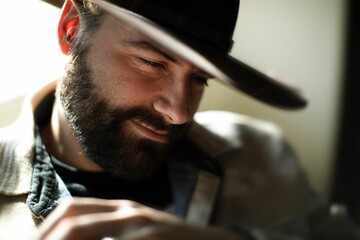 Bearded man in wide-brimmed hat