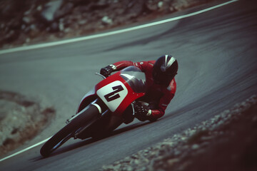 Obraz premium A motorcycle racer taking a sharp turn on a winding road, with lean angles showcasing their skills. A rider in action on a twisty road.