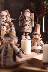 Handcrafted holiday figurines in cozy winter attire, perfect for festive and rustic holiday decor.