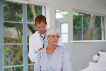 Cardiology, senior woman and doctor with stethoscope for rehabilitation, breathing and medical...