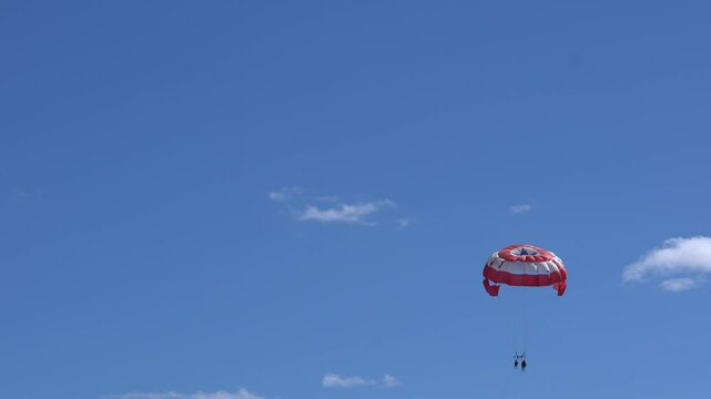 Aerial view following parasailers in sunny Cancun, Mexico