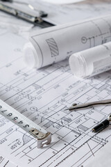 architect design working drawing sketch plans blueprints and making architectural construction model in architect studio,flat lay.