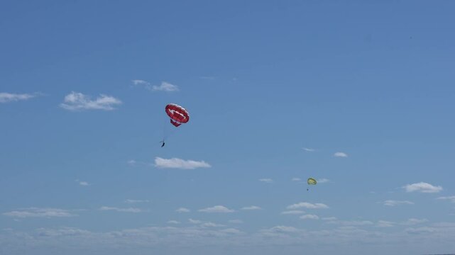 Aerial view following parasailers in sunny Cancun, Mexico