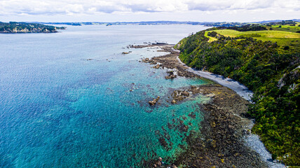 Blue ocean, waves and rocks. Aerial photo.