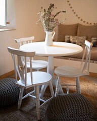 white table and chairs in guestroom