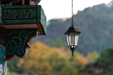 lamp hanging from the eaves of the Buddhist temple building