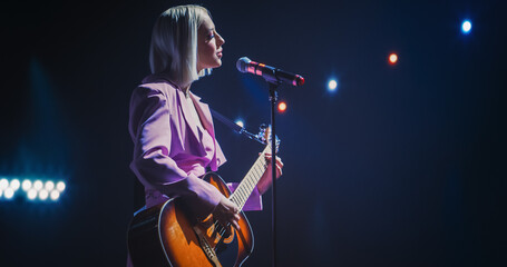 Portrait of a Beautiful Young Woman Singing a Country Song and Playing Guitar at a Music Contest. Cinematic Neon Spotlights Illuminates the Star, Her Empowering Presence and Lyrics Electrify the Stage