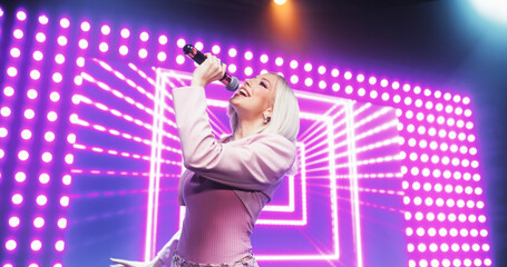 Fans Experiencing a Powerful Musical Performance by a Talented Young Singer. Beautiful Pop Band...