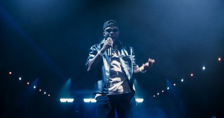 Young African Hip Hop Musician Delivers an Unforgettable Concert. Black Rapper Dancing in Smoke on...