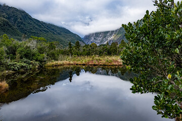 Roberts track, Franz Josef glacier, reflection of mountains in the lake, New Zealand