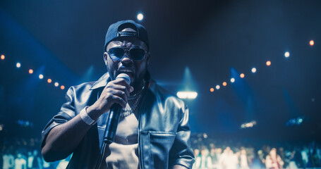Portrait of a Male Rapper Singing an Emotional Song. Spectacular Concert with a Talented Hip Hop...