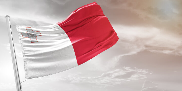 Malta national flag cloth fabric waving on beautiful grey Background.