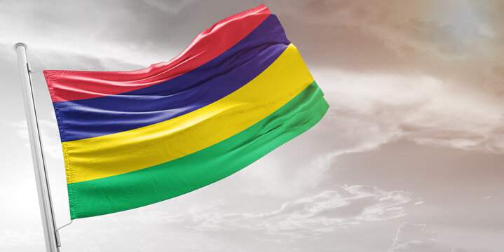 Mauritius national flag cloth fabric waving on beautiful grey Background.