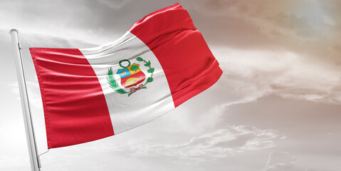 Peru national flag cloth fabric waving on beautiful grey Background.