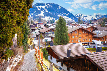 Idyllic Alpine village of Gstaad panoramic rooftops view, luxury winter destination