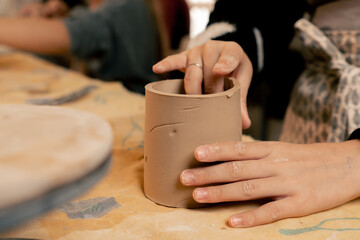 close-up in clay modeling studio applied art clay pottery old craftsmanship manual making of pottery smoothing out irregularities with a stack