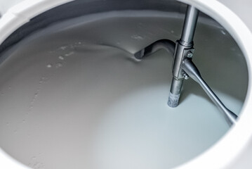 Vat-machine rotating blades of milk in ice-cream factory