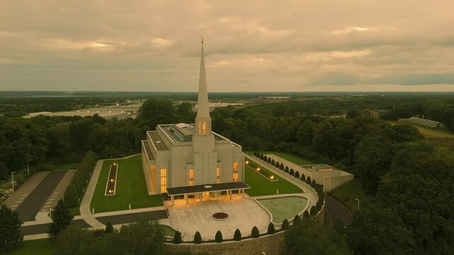 Chorley, Lancashire, UK, July 21, 2024; low level aerial orbit clip at sunset of the Preston England Temple Church of Latter Day Saints, Chorley Lancashire England