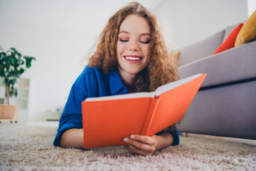 Photo of lovely charming girl wearing blue clothes lying floor writing diary cozy weekend day indoors living room apartment flat