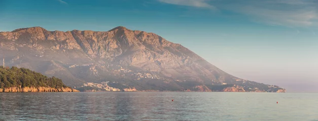 Fototapete Scenic view of mountains meeting the sea in Montenegro, creating a tranquil and picturesque landscape © EdNurg