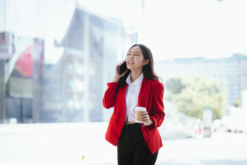 Asian businesswoman using a digital tablet working in the city